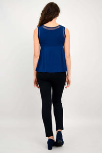 Back view of woman wearing navy mesh detail bamboo tank top and black pants