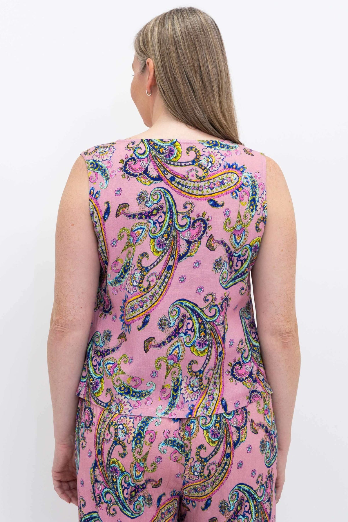 Back view of a woman showcasing the pink paisley cropped tank top