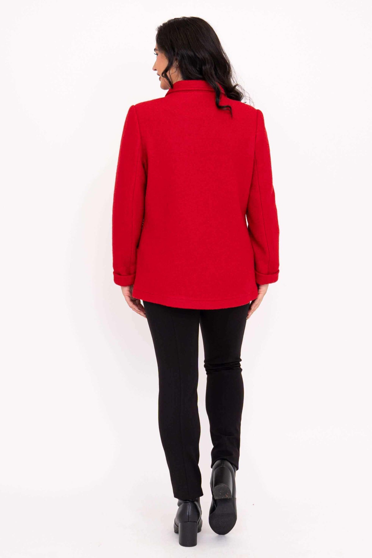 Back view of woman wearing a red wool blend coat