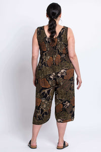 Back view of a woman wearing a wide-leg safari print jumpsuit