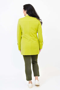 Back view of woman in lime green jacket and olive pants