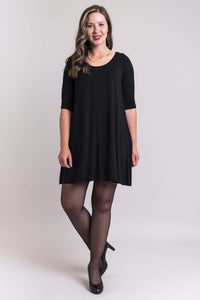 Woman in a black dress styled with a black bamboo bolero instant sleeve