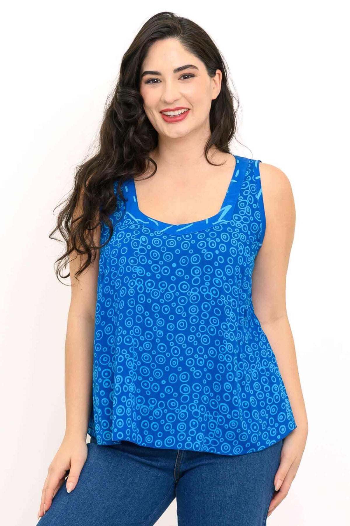 Woman wearing a blue batik sweetheart neckline sleeveless top, close-up