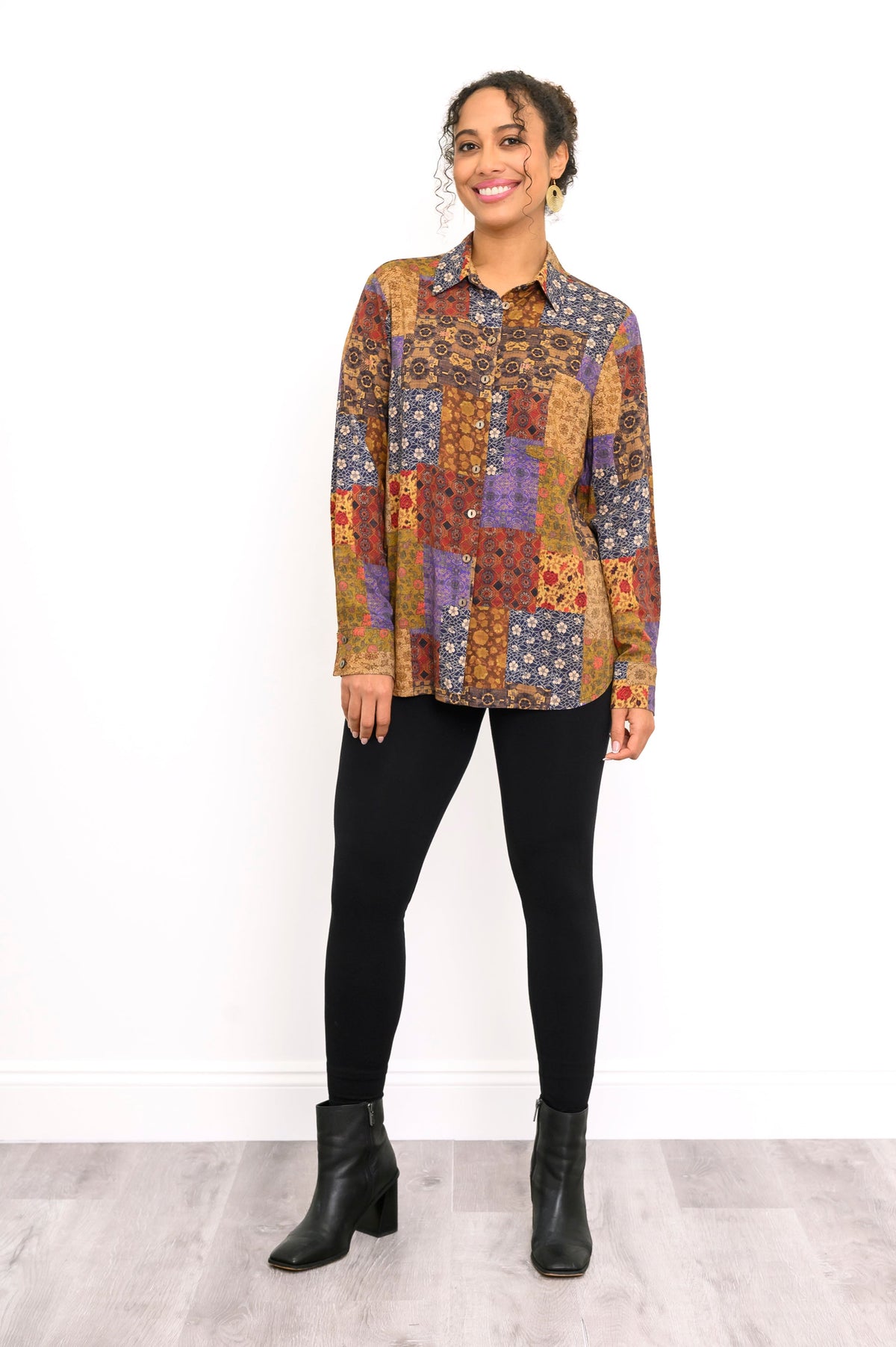 Wide shot of a relaxed-fit linen bamboo blend shirt featuring a colorful geometric and floral patchwork pattern