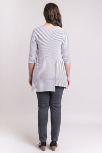 Women's black and white plus-size striped 3/4 sleeve tunic dress. Made with sustainable and fair-trade natural fibers. Back view.