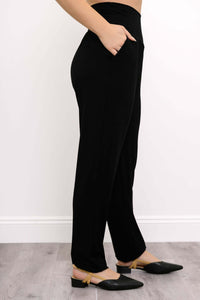 Side view of Clair black bamboo pants showing pocket and waistband