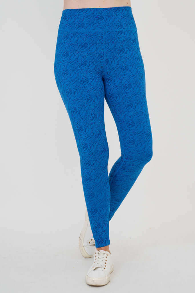 Model wearing cobalt blue Riley leggings, front angled view