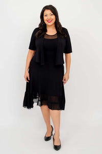 Model in black mesh hem dress paired with short sleeve black jacket