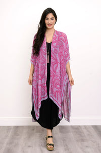 Front view of woman wearing pink and purple lace patterned kimono on a black outfit against a white background