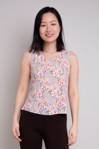 Women's pink rose floral print sleeveless muscle tank top with wide shoulder straps and scoop neck, made from natural bamboo fibers.
