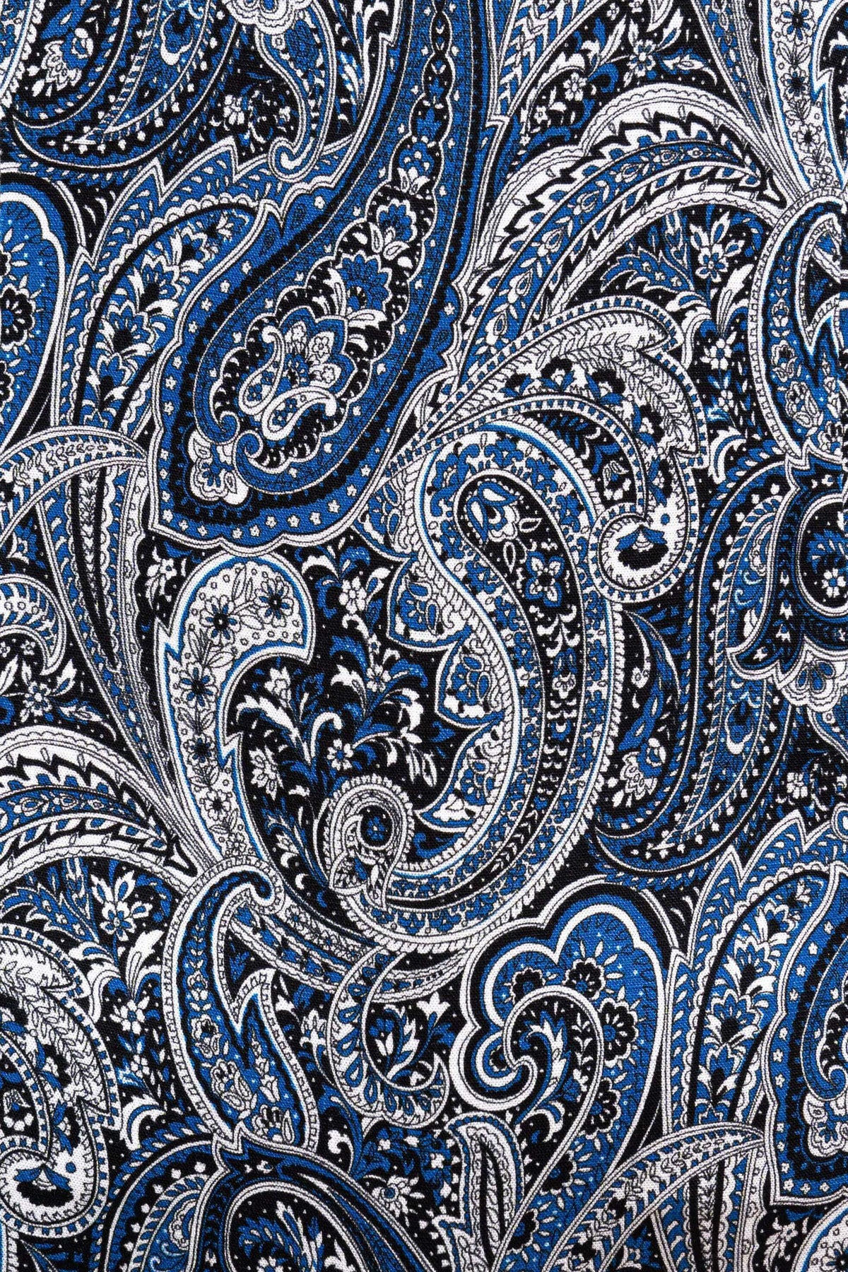Close-up detail of blue and white paisley pattern fabric