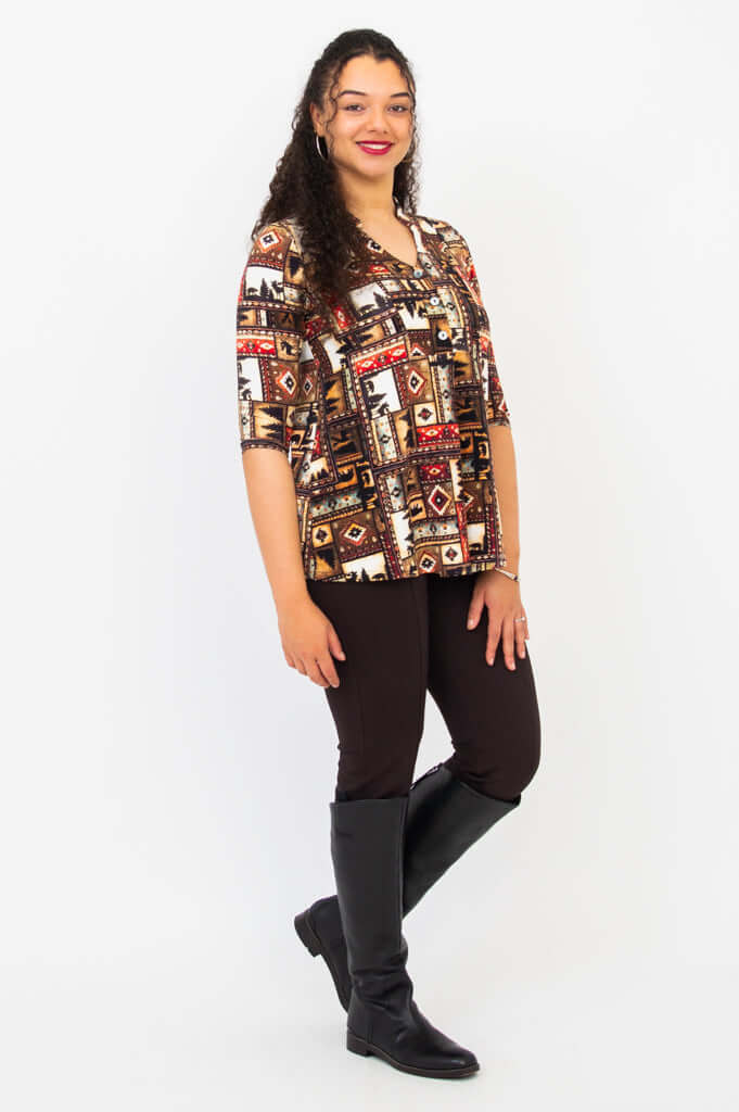 Side angle of model wearing Edwina top with western print and dark pants