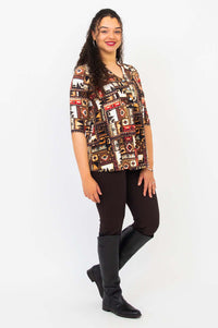 Side angle of model wearing Edwina top with western print and dark pants