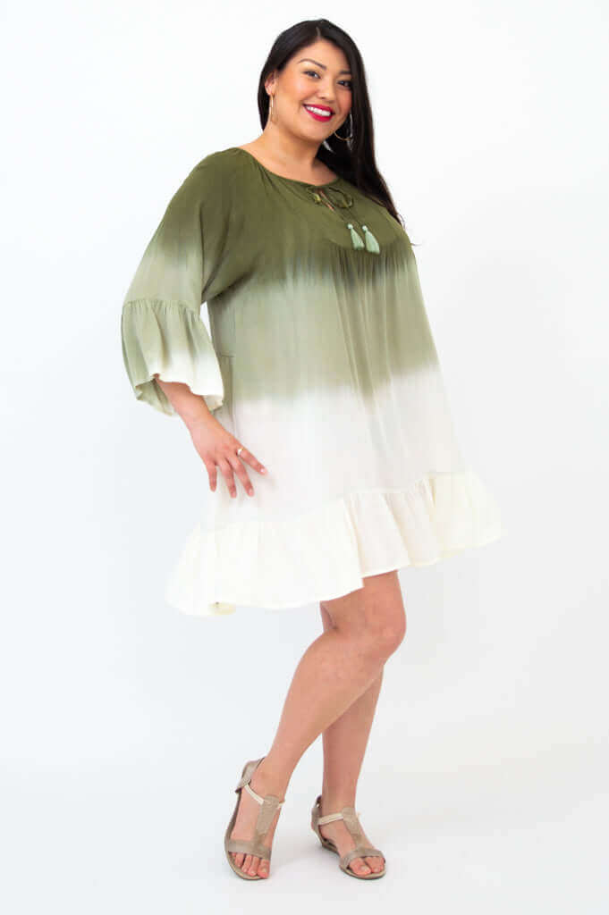 Side view of model in Ellie Dress, showcasing relaxed boho silhouette and tiered ruffle hem