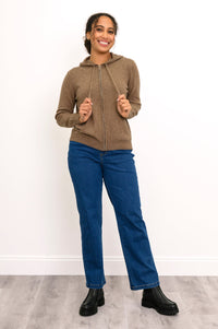 Front angle of woman wearing zip up hoodie in light brown cashmere with ribbed hem
