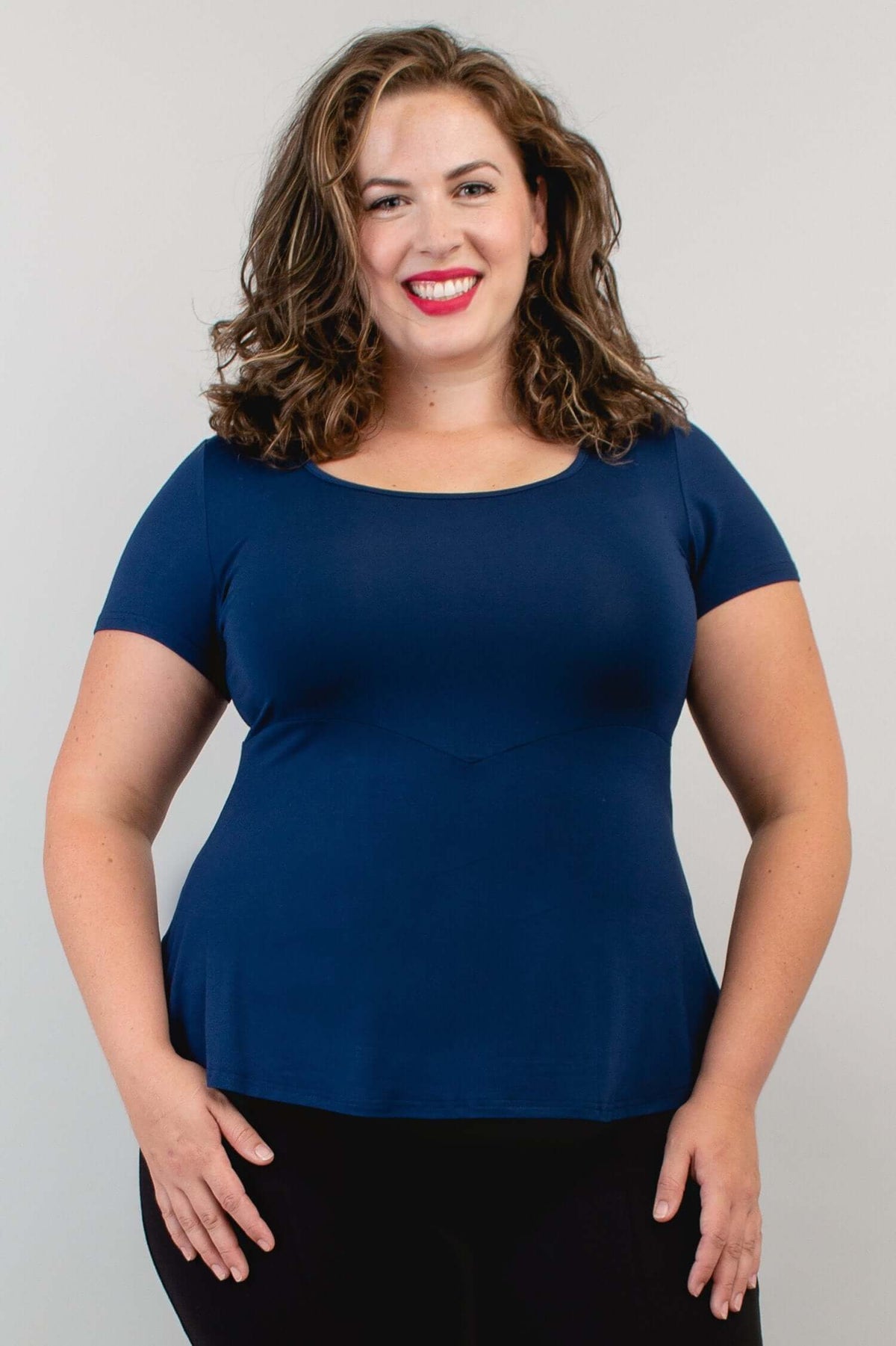 Front close-up of model wearing Kim Cap Top in navy with scoop neckline