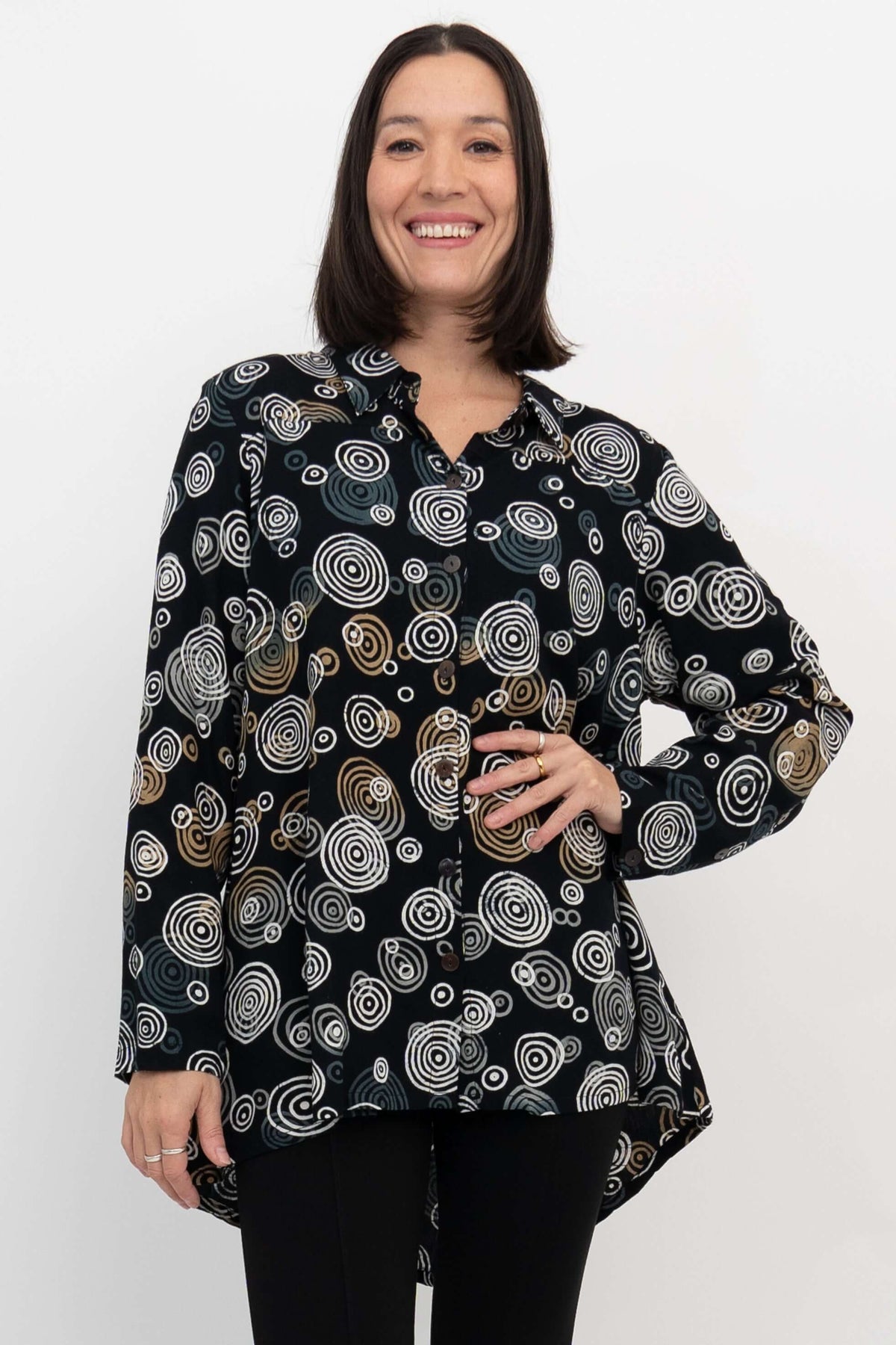 Front view of woman wearing the Stanley Blouse in black with abstract circle print