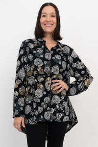 Front view of woman wearing the Stanley Blouse in black with abstract circle print