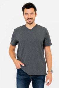 Front view of man wearing dark grey V-neck T-shirt with jeans