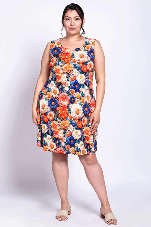 Front view of a woman wearing a sleeveless floral Maggie Shift Dress