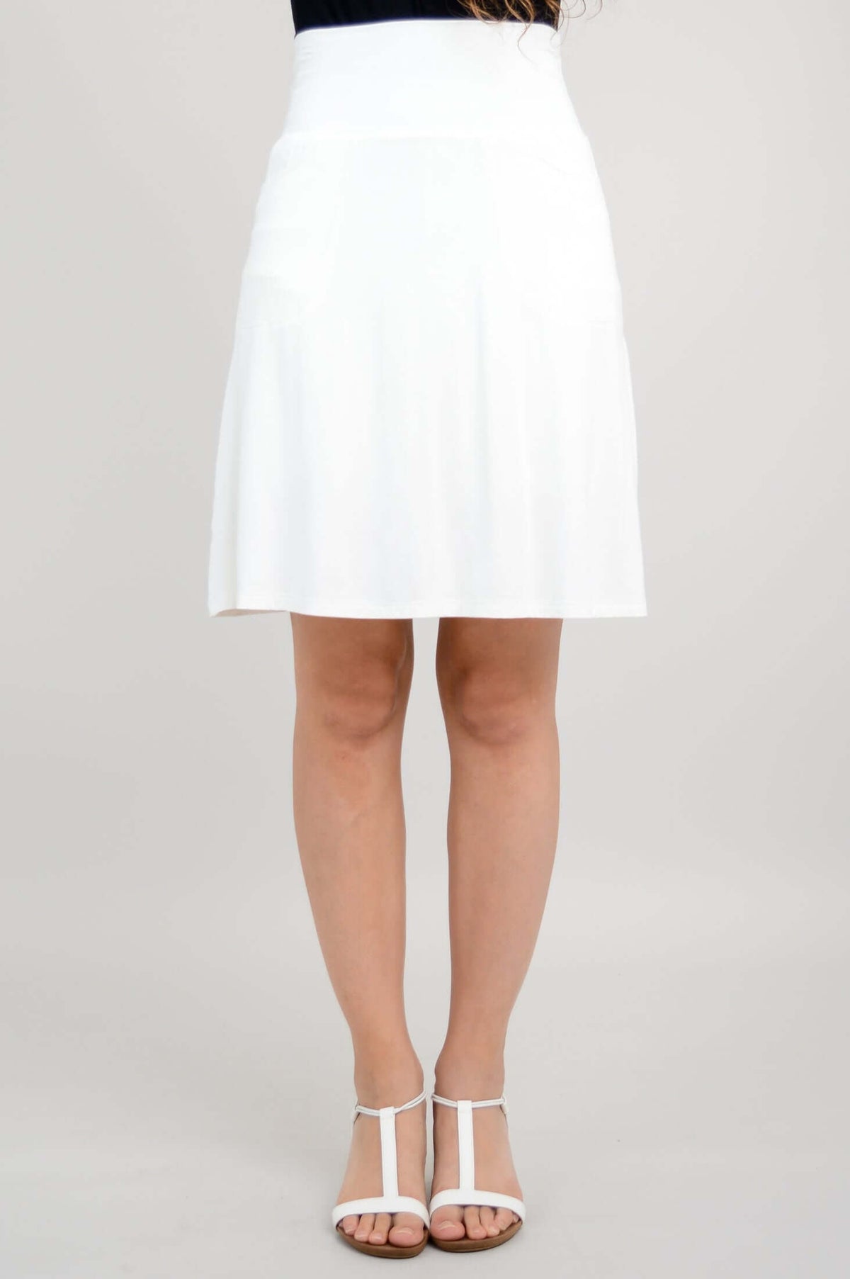 Front view of white Magna Skort on model with sandals