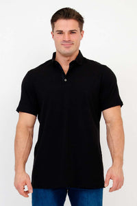 Front view of man wearing a black short sleeve bamboo polo shirt