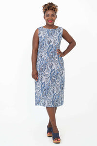 Front view of woman wearing blue paisley shift dress