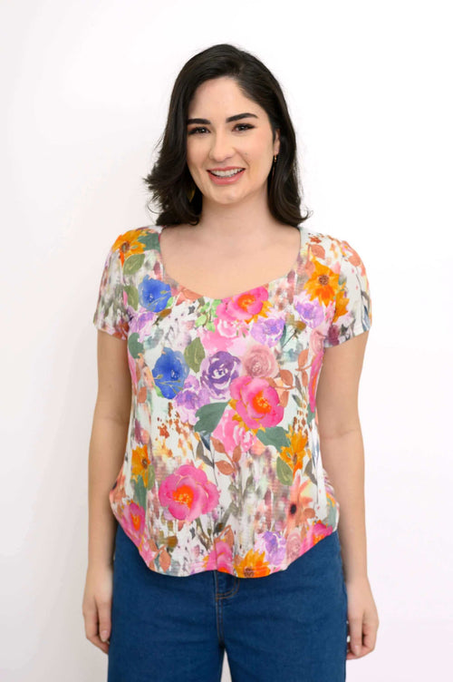 Front view of woman wearing a floral print sweetheart neckline short sleeve top