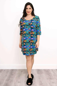 Woman in an ocean-themed bamboo sleepshirt, front view, standing and smiling