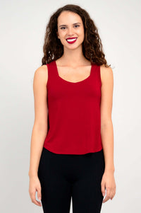 Front view of woman wearing red sweetheart neckline tank top with wide straps