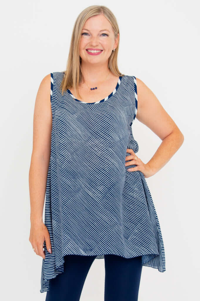 Front view of a woman wearing a navy and white striped swing tank top