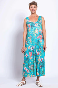 Full-length view of a woman modeling a turquoise floral jumpsuit