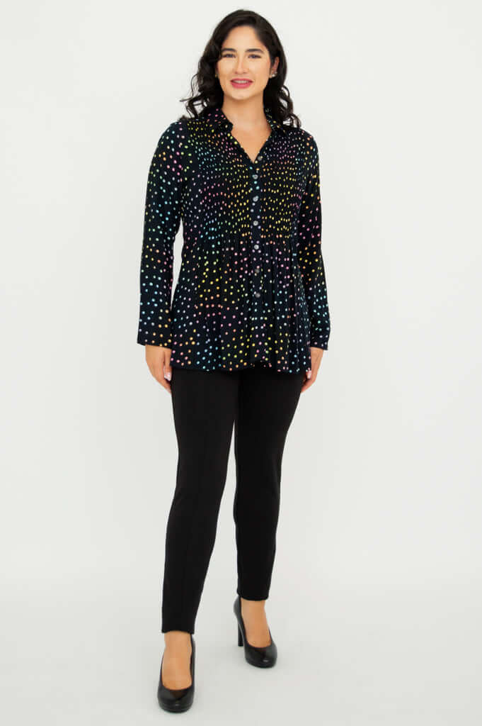 Full body front view of Cindy smocked dot shirt paired with black pants