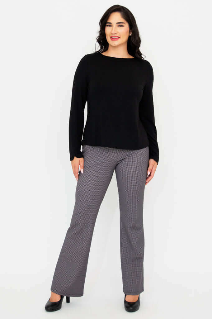Full body front view, woman modeling black Mona boat neck top and check pants