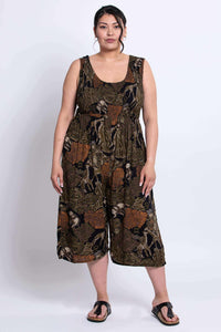 Full front pose of model in cropped animal print jumpsuit
