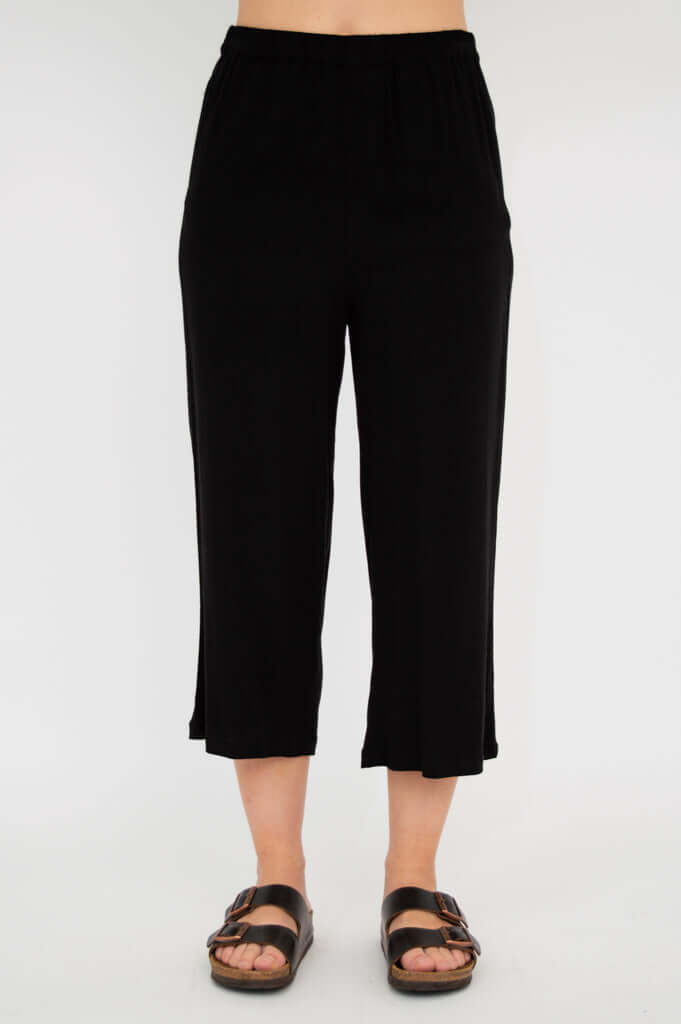 Full front view of black capri pants on model