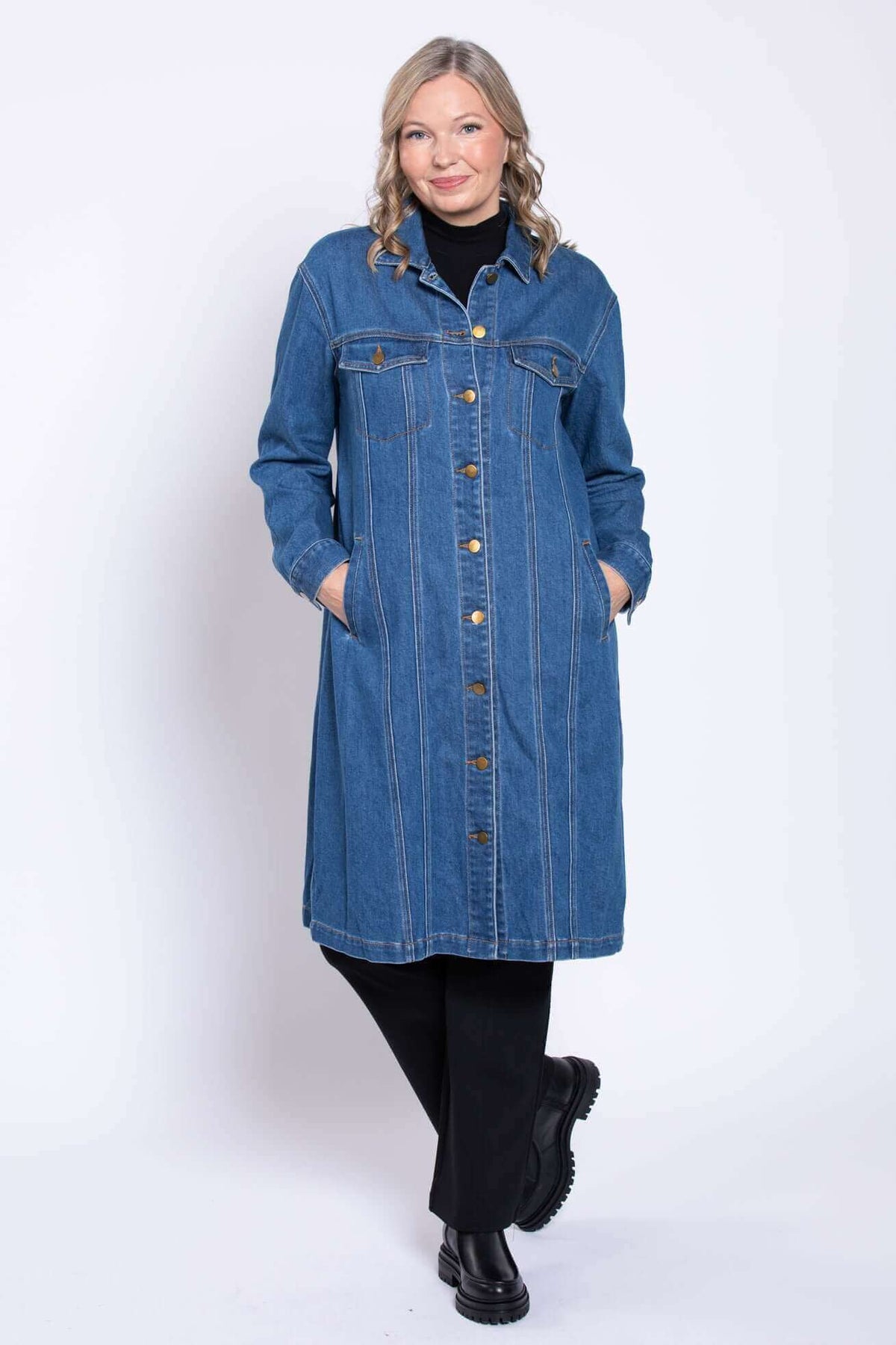A stylish women's long sleeve blue jean duster coat designed for versatile seasonal layering.