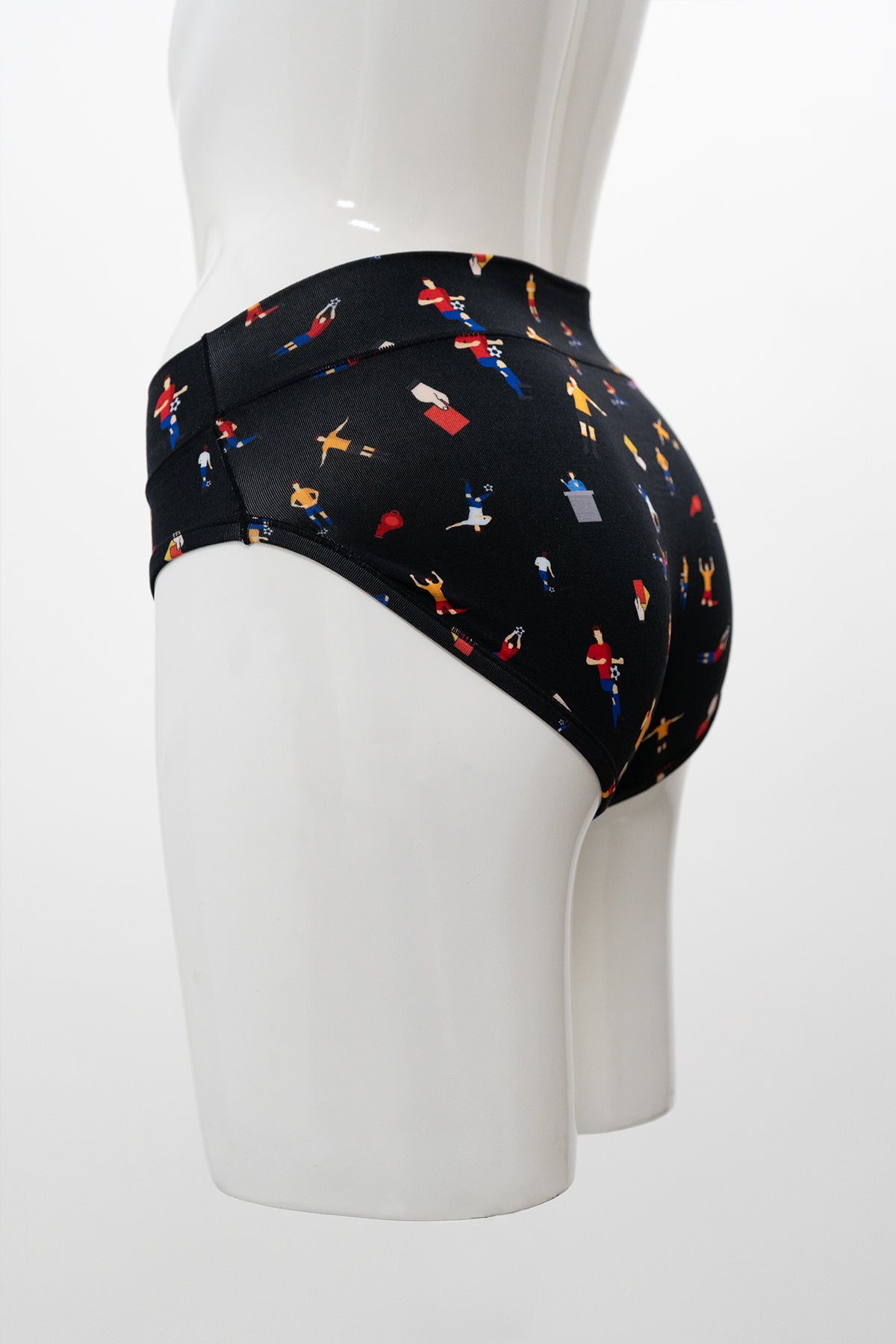 Side view of mannequin wearing a pair of full coverage black soccer print underwear