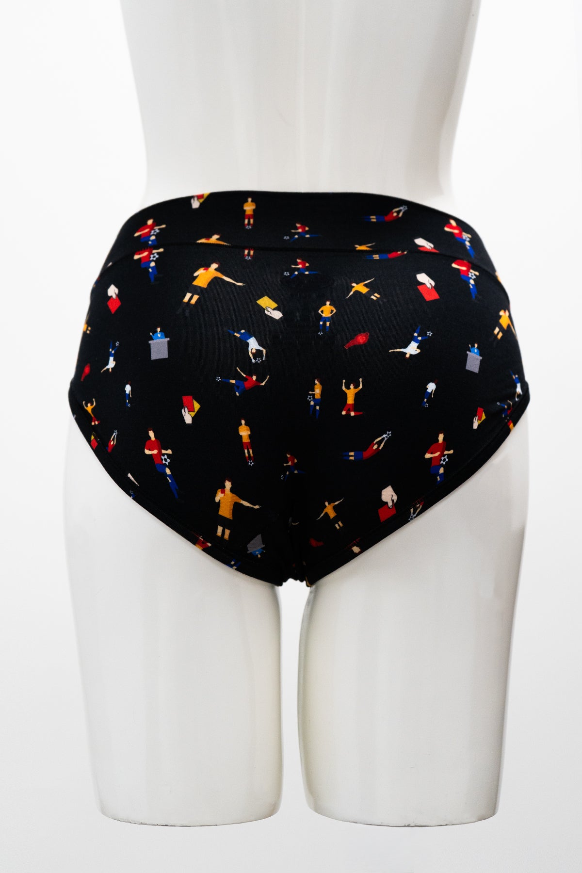 Back view of full coverage black woman's underwear featuring a soccer themed print