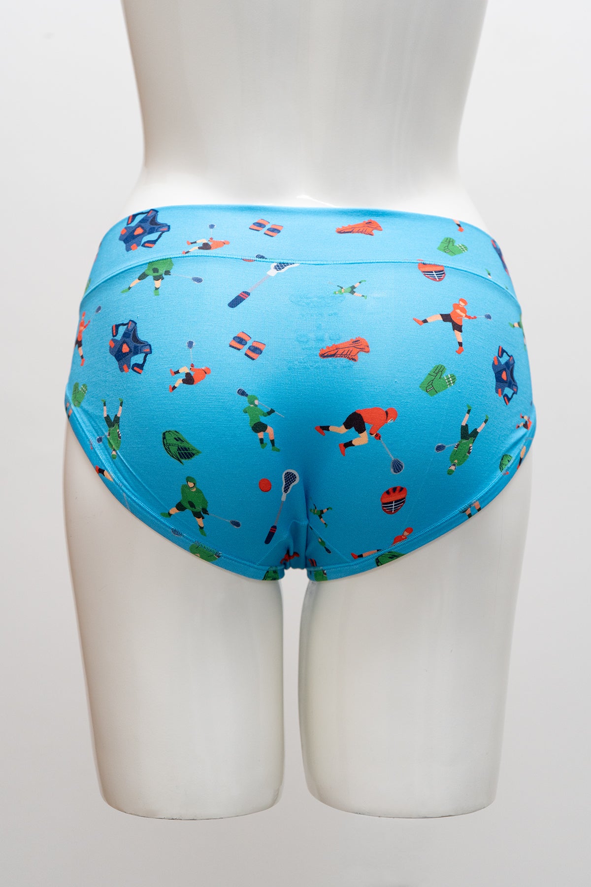 Blue underwear with a colorful lacross pattern on a mannequin against a white background, back view