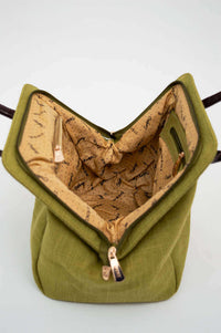 Interior view of olive green handbag showing fabric lining and compartments