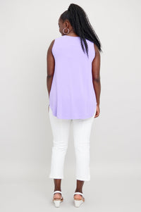 Back view of woman wearing lavender sleeveless tank with rounded hem and relaxed fit