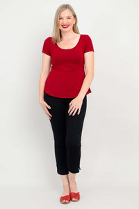Woman modeling Kim Cap bamboo top in cherry red, standing straight