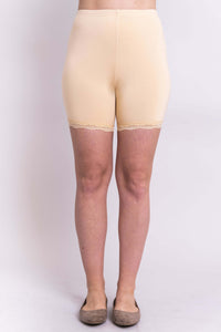 Model wearing bamboo nude undershorts with lace trim, front view