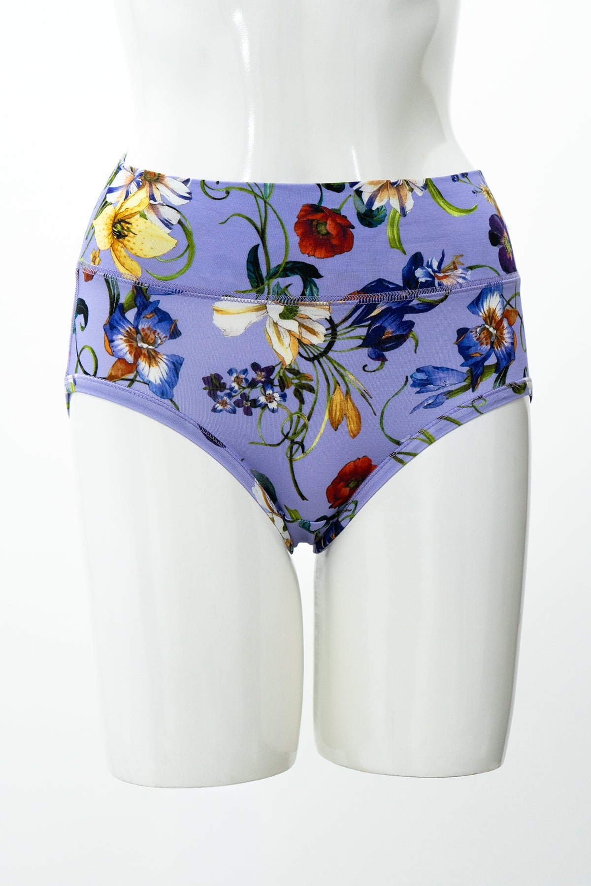 Purple woman's underwear with multicolor floral print displayed on a white mannequin