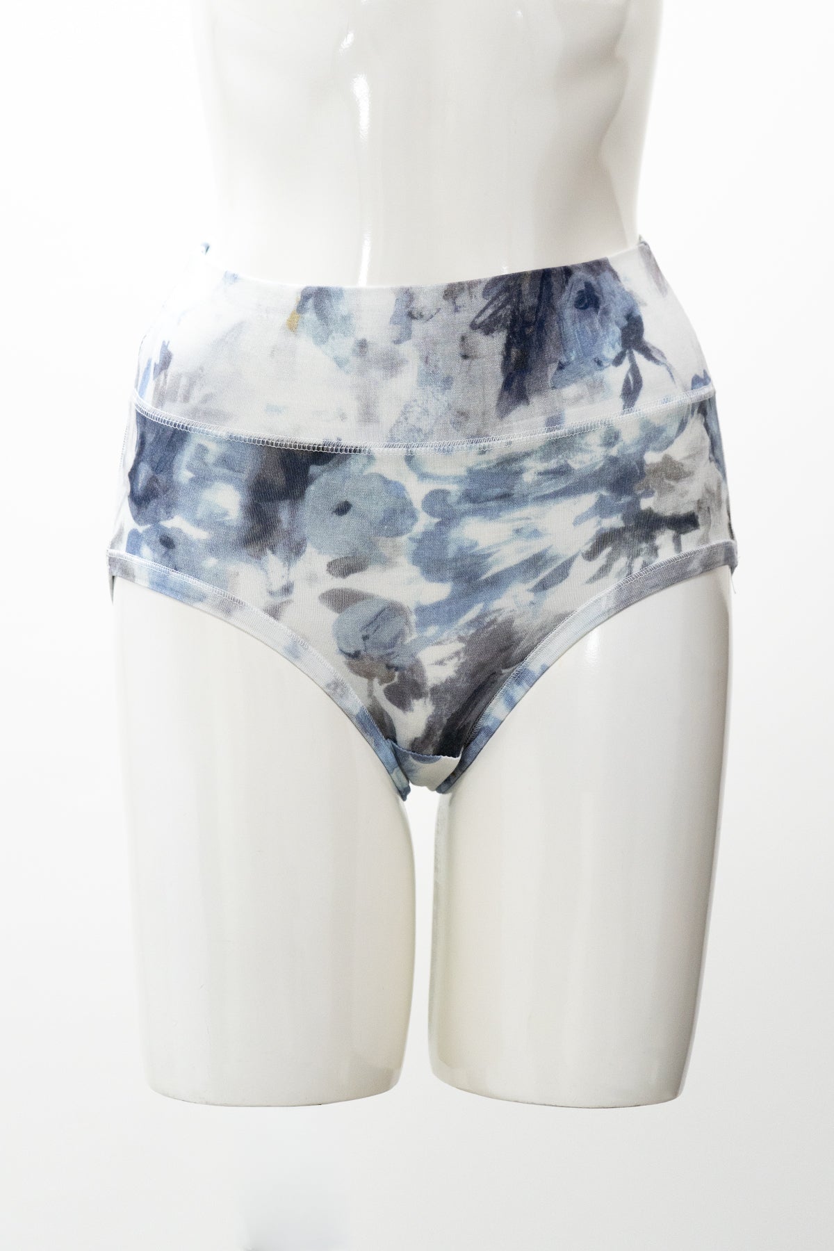 Blue and white patterned underwear on a mannequin against a white background