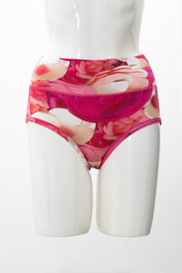 Front view of woman's red and pink floral printed underwear displayed on a white background