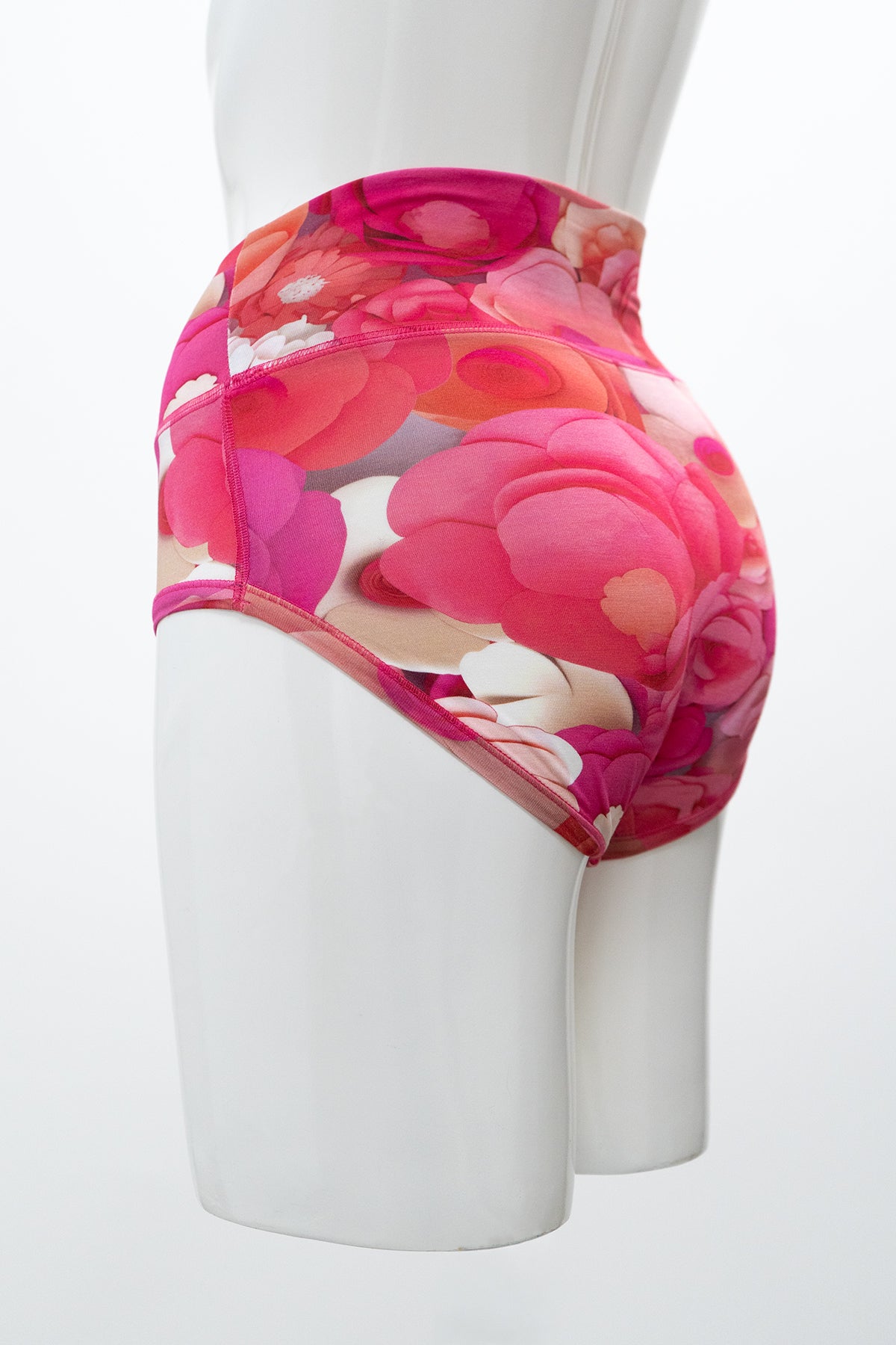 Side view of high-rise red and pin floral print woman's underwear featuring full-coverage bottom
