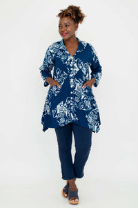 Full front view showing Laney Blouse styled with blue pants and heeled sandals