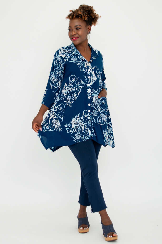 Side view of model twirling in the Laney Blouse, highlighting flowy silhouette